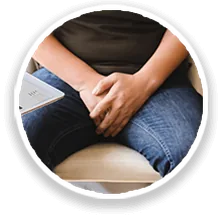 Man holding his lower abdomen, uncomfortable when urinating